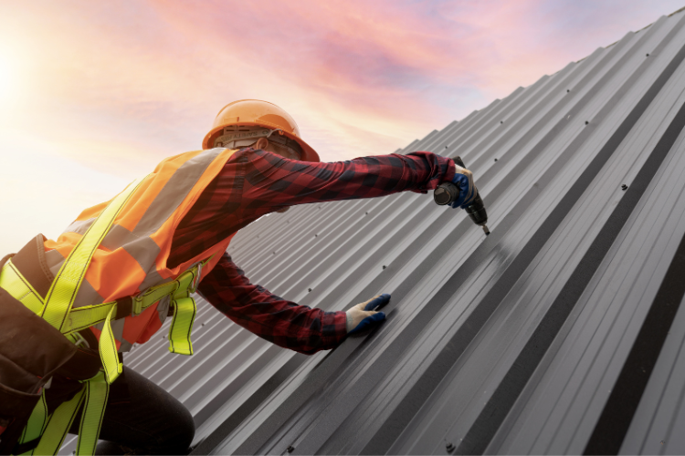 Roofers installing a metal roof in Coeur d'Alene