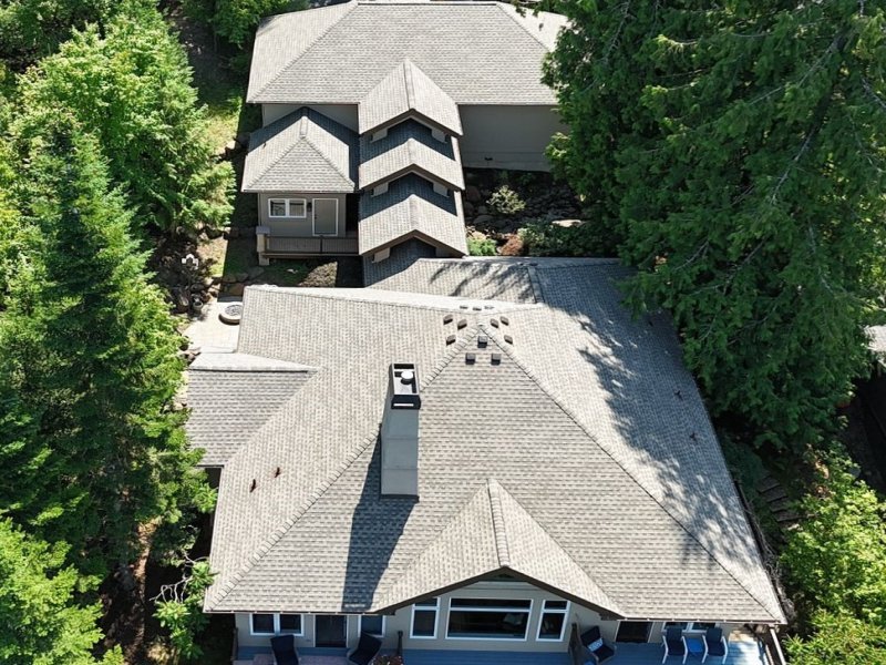 Drone shot of a Mid-class Home with Gray Slate Roof