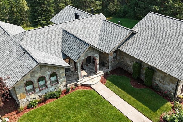 Close up of new gray shingles installed by Lake City Roofing on a home