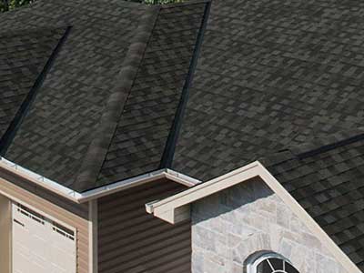 Close up of a residential roof with black IKO shingles