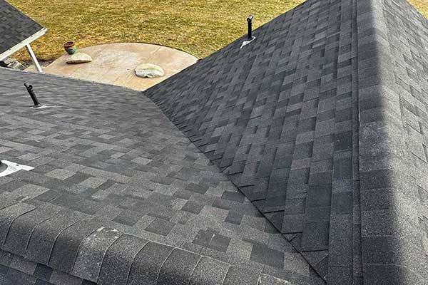 Close up of new gray shingles installed by Lake City Roofing on a home